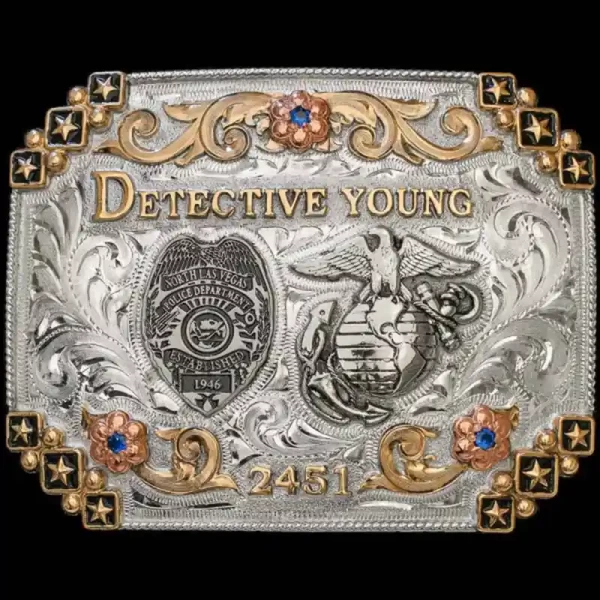The Marshall Belt Buckle pays hommage to law-enforcement and military members. Detailed with stars and inner bronze scrollwork, this unique buckle contains two customizable silver figures. Order today!